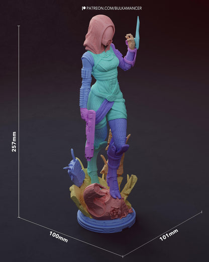 Colored 3D model render of a hooded sci-fi alien woman with pistol and energy blade on rocky base with size dimensions